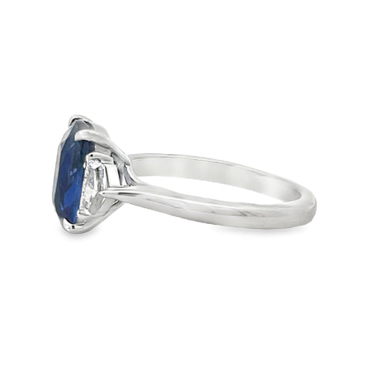 18KW EMERALD CUT BLUE SAPPHIRE WITH CADILLAC DIAMOND SIDE STONE RING