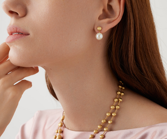 A real must-have, these petite 18K gold pearl drop earrings are discreet and always elegant, perfect for everyday wear. The surface is finely hand-engraved using the ancient Florentine technique which gives our gold a fine, brushed texture.