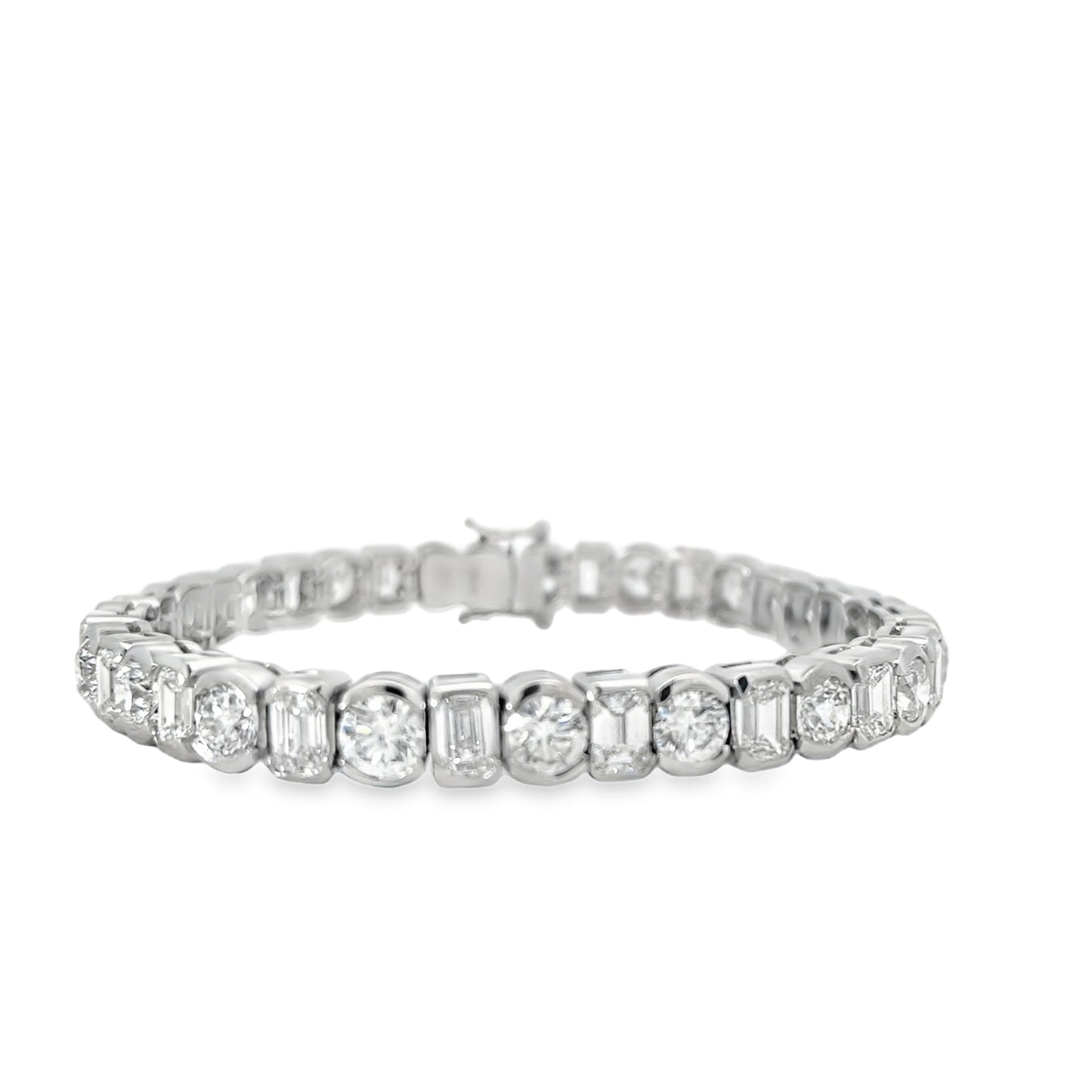 PLATINUM ROUND AND EMERALD CUT DIAMOND BRACELET