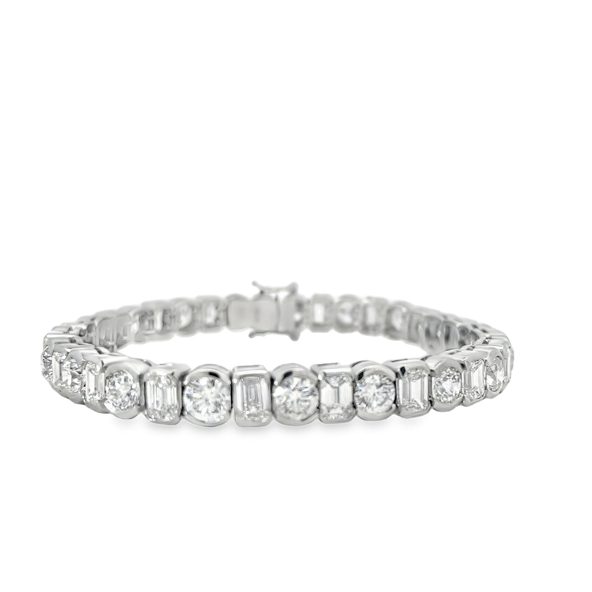PLATINUM ROUND AND EMERALD CUT DIAMOND BRACELET