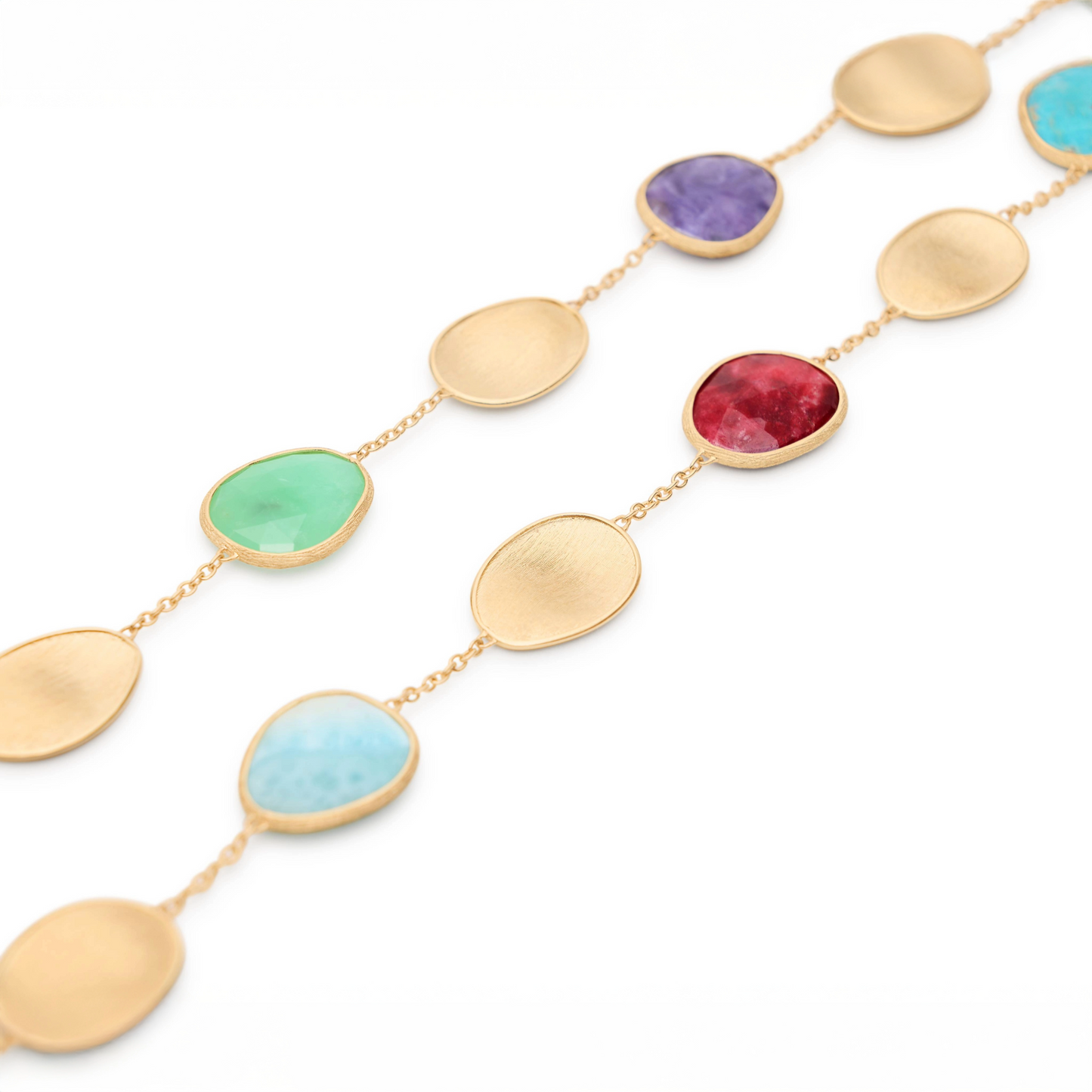 Elegant and striking, this necklace features a refined sequence of light 18K yellow gold leaves and a mix of colorful gemstones. The gold leaves are meticulously hand-engraved using the ancient Florentine technique, interspersed with a delicate chain. The perfect piece to complete any look with a vibrant touch of color.