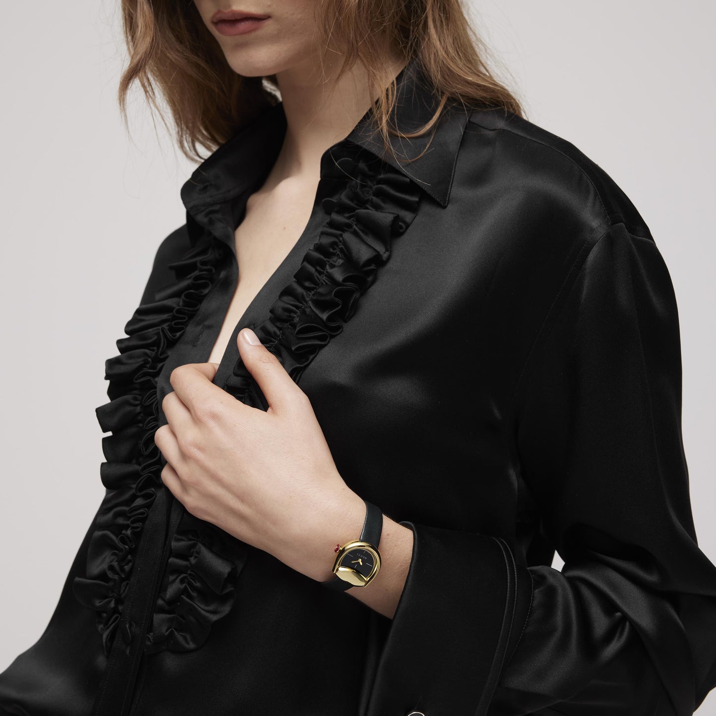 GOLD PLATED HORSEBIT BLACK DIAL WATCH
