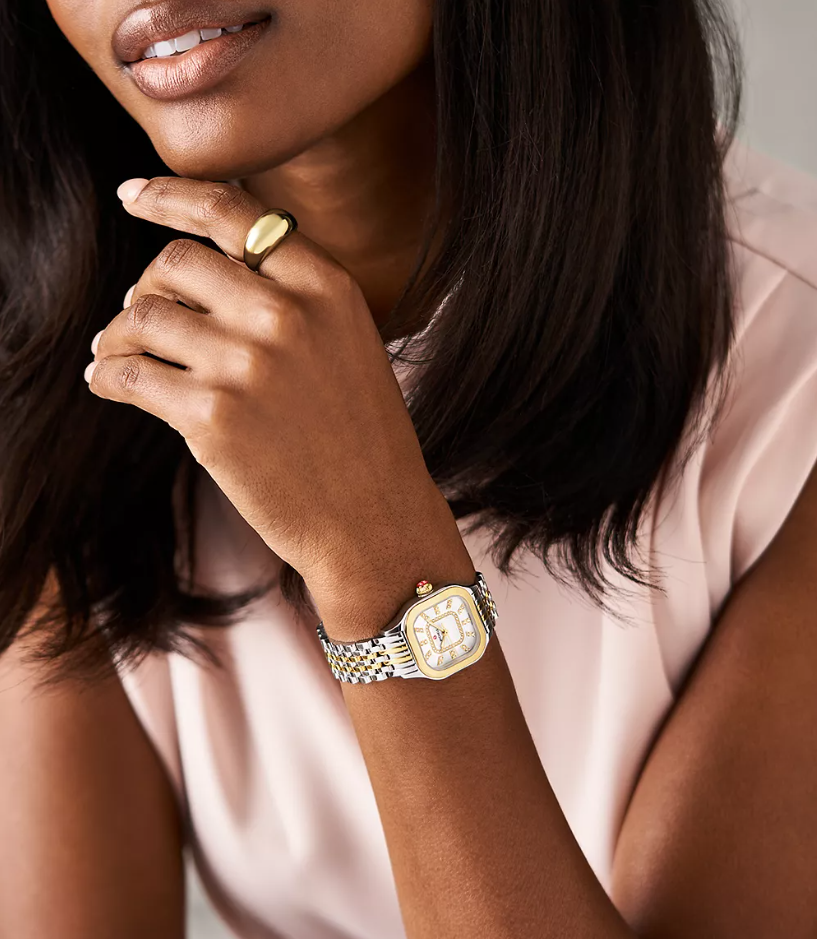 Elegant curves add modern elegance to the case of MICHELE's stunning Meggie watch that sparkles with 60 hand-set diamonds (0.19 carat weight) on the mother-of-pearl dial with diamond inner ring and double diamond indexes. This watch features a Swiss movement and a gleaming 14mm two-tone stainless and 18K gold-plated seven-link bracelet made specifically for the Meggie collection interchangeable with any 14mm MICHELE strap.