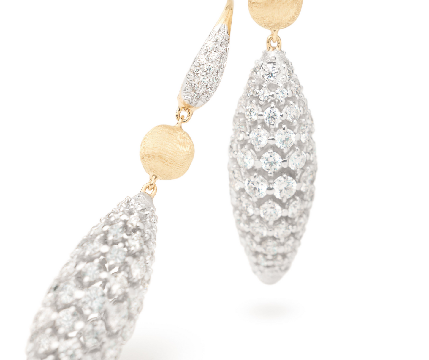 Sophisticated drop earrings featuring an 18k yellow gold bead, finely hand-engraved using the ancient Florentine technique and an eye-catching oval shape pavé-set diamond elements, suspended from graceful pavé clips. Already a classic.