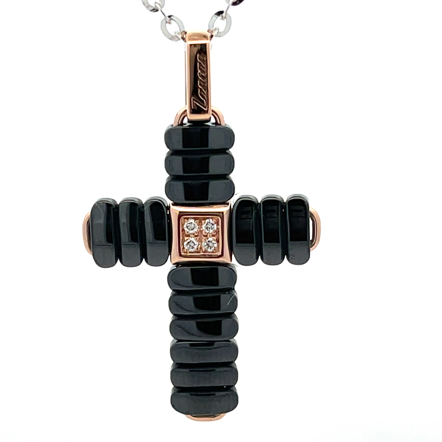 Zancan necklace with cross pendant in 18kt rose gold and black ceramic with white diamonds. The contrast between rose gold and shiny black ceramic gives this necklace a strong visual impact. A jewel of great mechanical complexity, which enhances to the fullest this piece of the highest jewelry. The necklace is part of the Ceramikgold collection, the collection that combines 18k gold and ceramic through complex processing techniques. It is completely handmade in Italy.