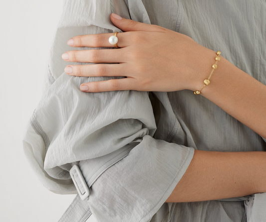 This 18K yellow gold ring is finely hand-engraved with the ancient Florentine technique which gives our gold a fine, brushed texture. A timeless pearl ring.