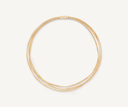 A timeless design featuring three strands of twisted coil that elegantly envelop the neck. This 18K yellow gold necklace is an iconic jewelry piece and an exquisite design object.
