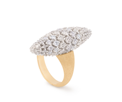 An 18K yellow gold ring full of volume, featuring a central oval shape pavé-set diamond element. The shank is finely hand-engraved using the ancient Florentine technique, which gives our gold a fine, brushed texture. That allows their powerful radiance to emanate