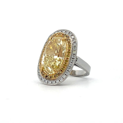 PLATINUM COCKTAIL RING WITH FANCY YELLOW OVAL DIAMOND