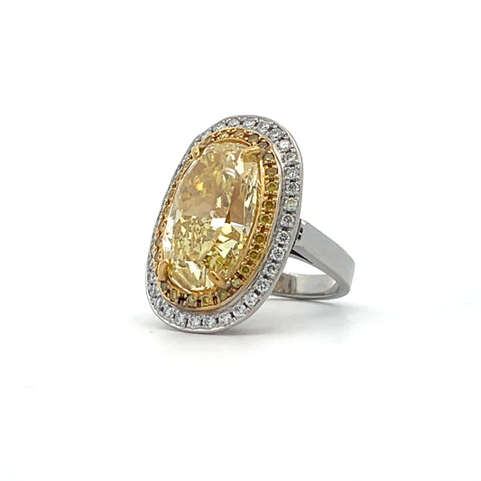 PLATINUM COCKTAIL RING WITH FANCY YELLOW OVAL DIAMOND