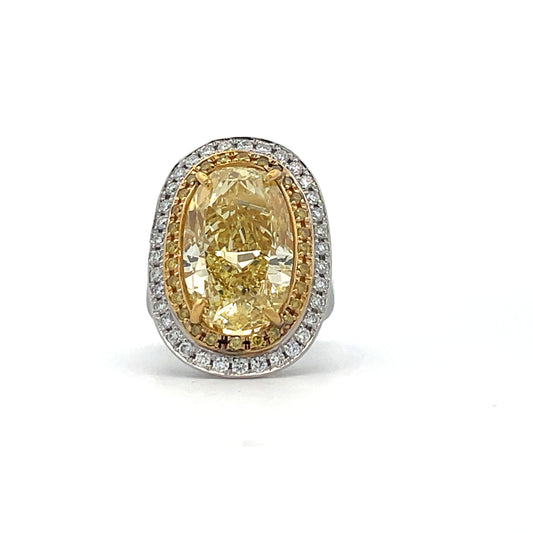 PLATINUM COCKTAIL RING WITH FANCY YELLOW OVAL DIAMOND