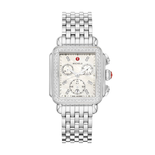 The rectangular case of the Deco Stainless Diamond Watch reflects the geometric shapes identified with Art Deco architecture. This iconic Swiss chronograph timepiece features 120 brilliant hand-set diamonds (0.6 carat weight) along the bezel and mother-of-pearl dial, three subeyes accented with silver foil and engraved MICHELE logos within the case walls. A stainless seven-link bracelet adds the finishing touch and is interchangeable with any 18mm MICHELE strap.