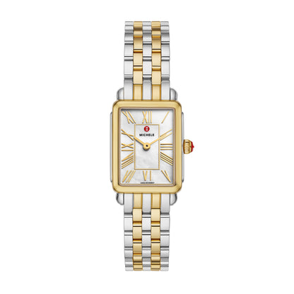 Elegant and architectural, this rectangular watch from the Deco Park collection perfectly balances form and function. The glossy white mother-of-pearl dial is housed within a two-tone stainless steel and 18K gold-plated case and Swiss movement. The two-tone 18K gold-plated bracelet is made specifically for the Deco Park collection and is interchangeable with any 14mm MICHELE strap.
