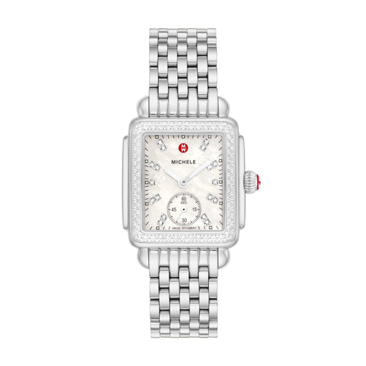 Inspired by the geometric shapes of Art Deco architecture, this stainless Deco Mid shines with 126 hand-set diamonds (0.57 carat weight) on the bezel and white mother-of-pearl dial adorned with double diamond hour markings. The signature MICHELE crown accents this stunning timepiece with a Swiss movement and the iconic seven-link stainless steel bracelet is interchangeable with any 16mm MICHELE strap.