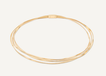 A timeless design featuring three strands of twisted coil that elegantly envelop the neck. This 18K yellow gold necklace is an iconic jewelry piece and an exquisite design object.