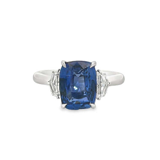 18KW EMERALD CUT BLUE SAPPHIRE WITH CADILLAC DIAMOND SIDE STONE RING