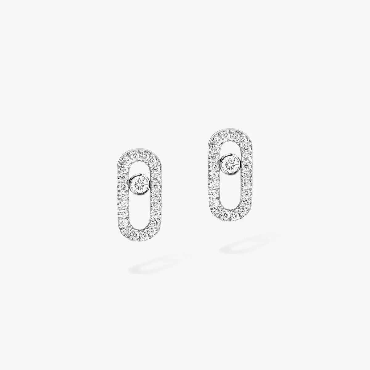 These pavé earrings in 18 karat white gold are part of Move, the signature collection of the Maison Messika.