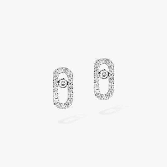 These pavé earrings in 18 karat white gold are part of Move, the signature collection of the Maison Messika.
