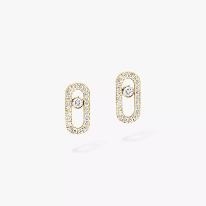 These pavé earrings in 18 karat yellow gold are part of Move, the signature collection of the Maison Messika.