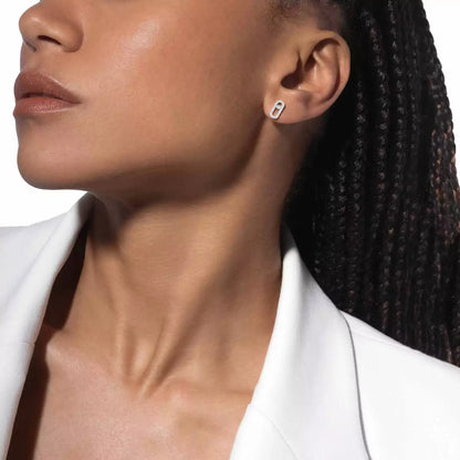 These pavé earrings in 18 karat white gold are part of Move, the signature collection of the Maison Messika.