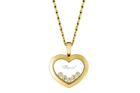 A heart pendant from Chopard features five small diamonds