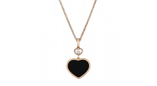 a rose gold necklace featuring two heart motif pendants, one filled with black