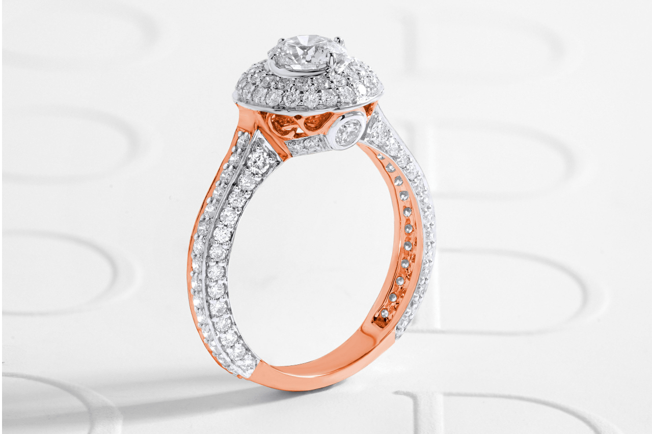 A close-up of a stunning two-toned engagement ring with diamond accents.