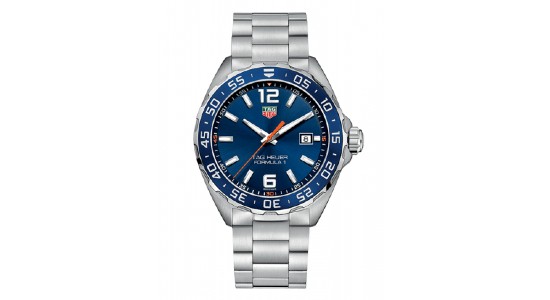 a silver watch with a blue dial by TAG Heuer