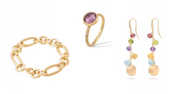 a gold chain bracelet, a gold ring with a purple center stone, and gemstone earrings by Marco Bicego