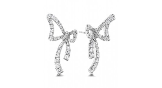 A white gold pair of bow stud earrings dotted with diamonds, available at Weston Jewelers.