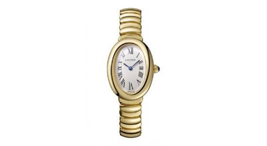 a yellow gold watch with oval case and metal strap